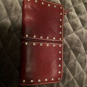 Michael Kors Burgundy wallet. Lots of space.
